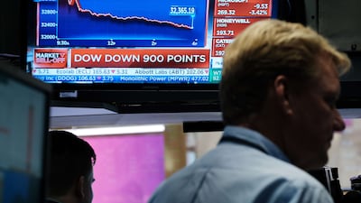 Traders work on the floor of the New York Stock Exchange. The Dow Jones Industrial Average dropped more than 1,000 points following a speech by Federal Reserve chairman Jerome Powell. AFP