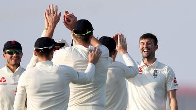 England's Mark Wood takes the wicket of Pakistan's Shan Masood.
