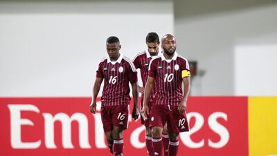 Al Wahda’s Abdulla Alnobi, left, Ismail Matar, right, and Hussain Fadel, centre, react to Al Sadd’s extra-time goal that sent the game to penalties. Christopher Pike / The National