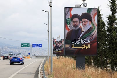 A billboard outside Beirut shows Iran's supreme leader Ayatollah Mojtaba Khamenei and his late father Ali Khamenei. Reuters
