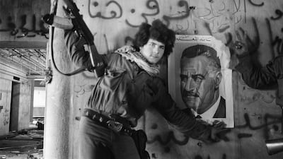 A pro-Palestinian fighter poses by a poster of late Egyptian President Gamal Abdel Nasser on the wall of the Holiday Inn in Beirut on March 24, 1976, days after pro-Palestinian militias dislodged Lebanese Christian forces from the 27-storey hotel. All photos: AFP