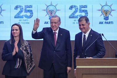 Izmir Mayor Cemil Tugay, right, with his wife Oznur Tugay, left, and Turkish President Recep Tayyip Erdogan. AFP