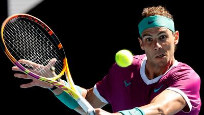 Spain's Rafael Nadal hits a return against Marcos Giron of the US during their men's singles match on day one of the Australian Open tennis tournament in Melbourne on January 17, 2022. (Photo by Brandon MALONE / AFP) / -- IMAGE RESTRICTED TO EDITORIAL USE - STRICTLY NO COMMERCIAL USE --