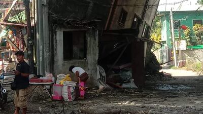 The quake left many buildings leaning to the side while others ended up with deep cracks in the walls. EPA