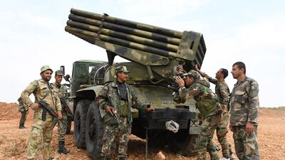A handout picture released by the official Syrian Arab News Agency shows Syrian regime units deploying in the northern city of Manbij, near the Turkish border. AFP PHOTO
