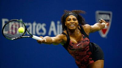 Serena Williams attempts to return a shot to sister Venus during their quarter-final match at the US Open on Tuesday. Al Bello / Getty Images / AFP