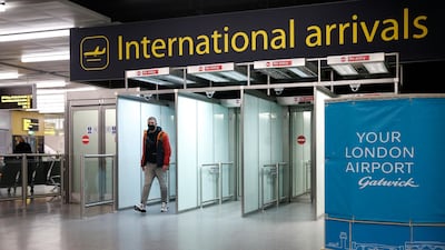 A traveller arrives at Gatwick Airport south of London, ahead of the start date of the UK's hotel quarantine system. Getty Images