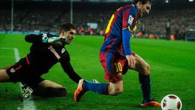 Lionel Messi, right, dribbles past Athletic Bilbao's Gorka Iraizoz during Barca's 2-1 win at Camp Nou.