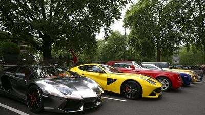 Some people may think that an expensive car proves they are successful. Carl Court / Getty Images