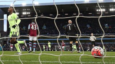 Manchester City's Kelechi Iheanacho begins to celebrate after scoring their third goal against Aston Villa on Saturday. Justin Tallis / AFP