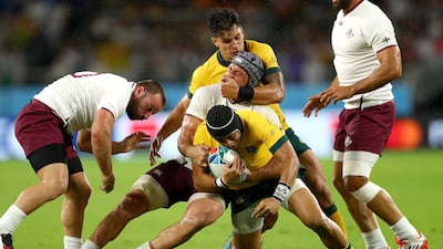Christian Lealiifano of Australia is tackled by Georgia's Beka Gorgadze. Getty