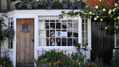 A ‘Vote Remain’ sign is posted on a window a house near Charing, south east of London. Ben Stansall / AFP