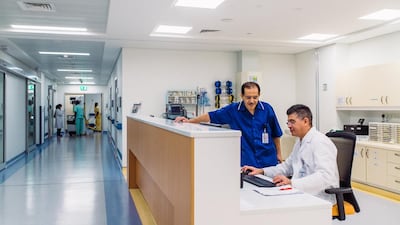 Left, Ahmad Sabbah, a nurse manager, and Jose Salmon, a critical care specialist, in Rashid Hospital in Dubai. The study found that diversity is a positive in the workplace. Alex Atack for The National.