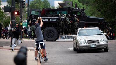 Police are seen as protesters march in Denver, Colorado, US. Reuters