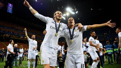 Gareth Bale and Lucas Vazquez of Real Madrid celebrate winning the UEFA Champions League. Real is second only to Man Utd in terms of brand value. Shaun Botterill / Getty Images