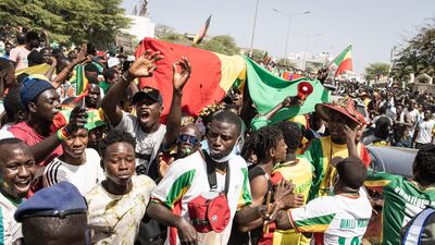 Supporters cheers ahead of Senegal team's arrival in Dakar a day after the national team defeated Egypt in the Africa Cup of Nations final. AFP