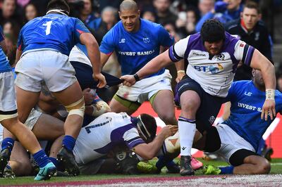 Scotland's hooker Stuart McInally, centre, scores a try during their Test against Samoa at Murrayfield. Andy Buchanan / AFP