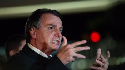 President of Brazil Jair Bolsonaro speaks with press about the controversial cabinet meeting video recently disclosed on May at Alvorada Palace on May 22, 2020 in Brasilia. Getty
