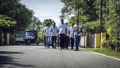 A funeral procession walks down the road in Negombo, Sri Lanka, April 23, 2019. Jack Moore / The National.