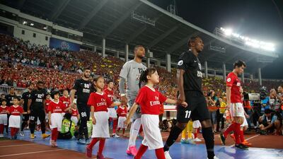 Players from the UAE's Al Ahli walk onto the field before the AFC Champions League football final in Guangzhou, in southern China's Guangdong province. AFP Photo