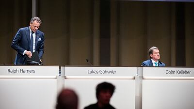 UBS Group’s former chief executive Ralph Hamers and its chairman Colm Kelleher at the end of the banking company’s AGM in Basel, Switzerland, on Wednesday. Reuters