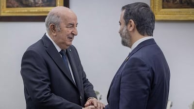 Syrian Foreign Minister Asaad Al Shibani, right, meets Algerian President Abdelmadjid Tebboune in Algiers. Photo: Sana