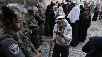 Palestinians are blocked by Israel security forces from entering the Al Aqsa Mosque compound, Islam's third-holiest site, on Sunday. Ahmad Gharabli / AFP