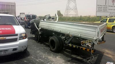 A lorry and a bus were involved in a crash on the hard shoulder of Sheikh Mohammed bin Zayed Road. Courtesy Dubai Police Department