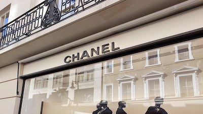 The Chanel window on Old Bond Street in London features mannequins dressed in black.
