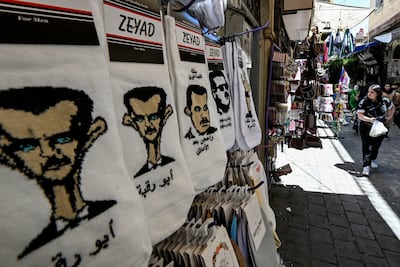 Socks bearing caricatures of Bashar Al Assad on sale in a market in Damascus. AFP