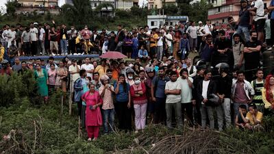 A crowd gathers at the site of the crash. Reuters