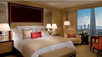 The simple, beige rooms at the Ritz-Carlton in Toronto offer a magnificent view of the CN Tower and Lake Ontario. Courtesy of The Ritz-Carlton