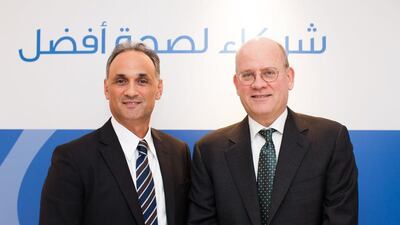 Maher Abouzeid, the president and chief executive for eastern growth markets at GE, and John Flannery, the president and chief executive of GE Healthcare during the Arab Health conference in Dubai. Anna Nielsen for the National