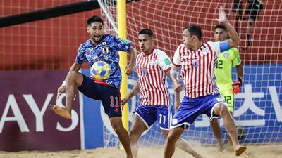 Japan's Masanori Okuyama, left, under pressure from Pedro Moran and Sergio Villaverde of Paraguay. EPA