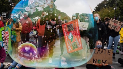 Supporters of Fridays For Future hold placards as they demonstrate in Berlin, Germany. EPA