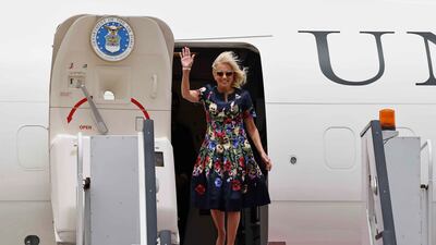 US first lady waves as she arrives at Cairo International Airport wearing Oscar de la Renta. EPA