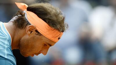 Nadal prepares to serve to Djokovic. AFP