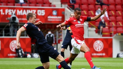 Leipzig's German defender Lukas Klostermann, left, and Mainz' Swedish midfielder Robin Quaison vie for the ball. AFP
