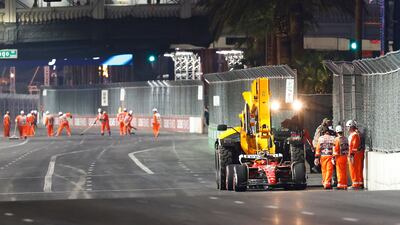 The car of Carlos Sainz is removed from the circuit on a truck after stopping on track during practice. AFP