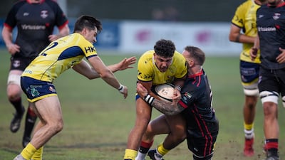 Action from the the UAE Premiership final between Dubai Exiles (black) v Dubai Hurricanes (yellow) held at The Sevens in Dubai