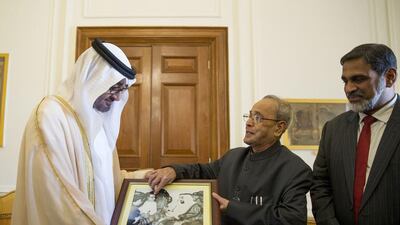 Sheikh Mohammed bin Zayed, Crown Prince of Abu Dhabi and Deputy Supreme Commander of the Armed Forces receives a photograph from Pranab Mukherjee President of India after conducting a meeting at Rashtrapati Bhavan. Mohamed Al Hammadi / Crown Prince Court — Abu Dhabi