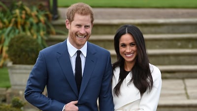 Britain's Prince Harry poses with Meghan Markle in the Sunken Garden of Kensington Palace, London. Reuters
