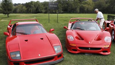 A 1990 Ferrari F40 (left) and a 1995 Ferrari F50 are detailed prior to the opening of The Quail. Michael Fiala / Reuters