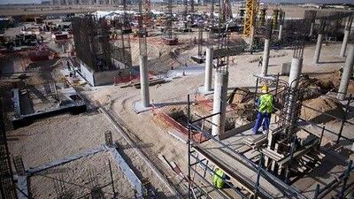 One of Masdar City's major buildings, the Siemens headquarters, is under construction at the Masdar City near Abu Dhabi. Silvia Razgova / The National