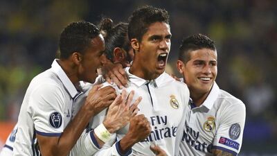 Real Madrid’s Raphael Varane reacts with teammates after scoring. Kai Pfaffenbach / Reuters