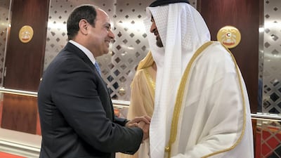 Sheikh Mohammed bin Zayed, Crown Prince of Abu Dhabi and Deputy Supreme Commander of the UAE Armed Forces (R), greets Abdel Fattah El Sisi, President of Egypt (L), during a reception at the Presidential Airport. Mohamed Al Hammadi / Crown Prince Court - Abu Dhabi ---