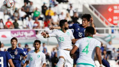 Japan's Takehiro Tomiyasu scores with a header. Reuters