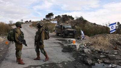 Israeli soldiers outside the former settlement of Homesh, west of the West Bank city of Nablus, in December 2021. Settlers may return under a change to law by the Knesset on Tuesday. AFP