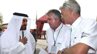 Mohammed Ben Sulayem, the president of the Automobile and Touring Club of the UAE, talks to Yas Marina Circuit officials Ronan Morgan and John Spiller during their visit to the Bahrain Grand Prix yesterday.