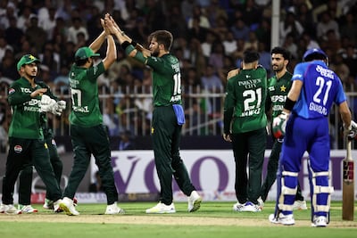 Pakistan's Shaheen Afridi celebrates with teammates after taking the wicket of Afghanistan's Ibrahim Zadran in Sharjah. AFP